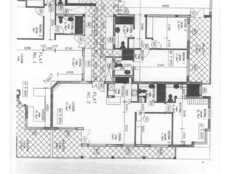 A detailed architectural floor plan showing the layout of the second floor, including multiple flat units with bedrooms, kitchens, and bathrooms.