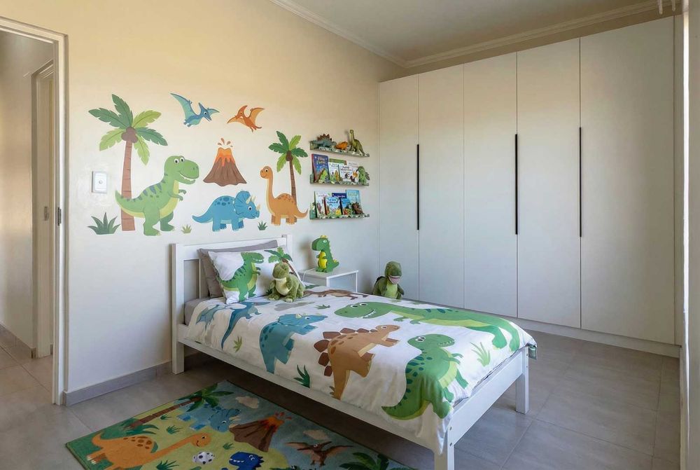 Spacious 3rd bedroom with built-in cupboards.