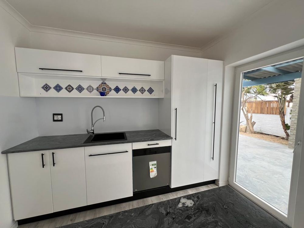 Kitchen and doors leading to patio