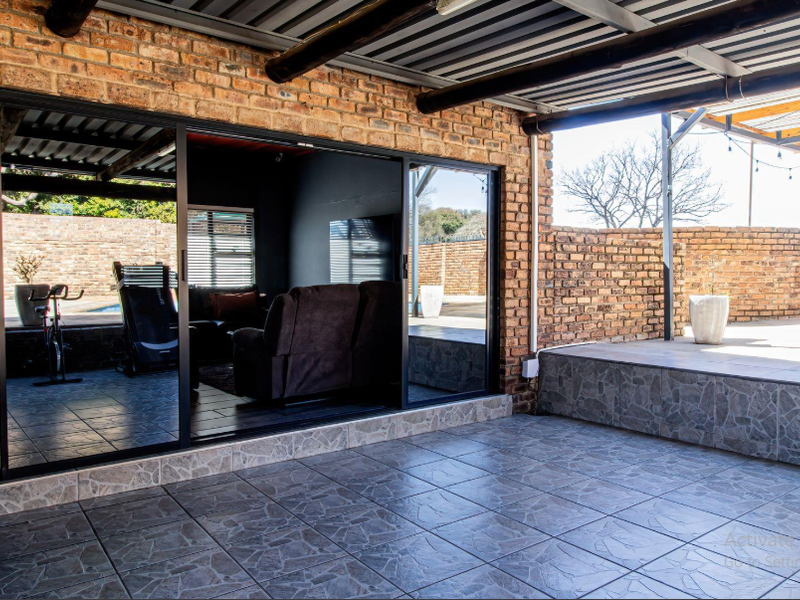 Entertain in Style: Covered Braai with a Pool in This Stunning Home - Photo 9