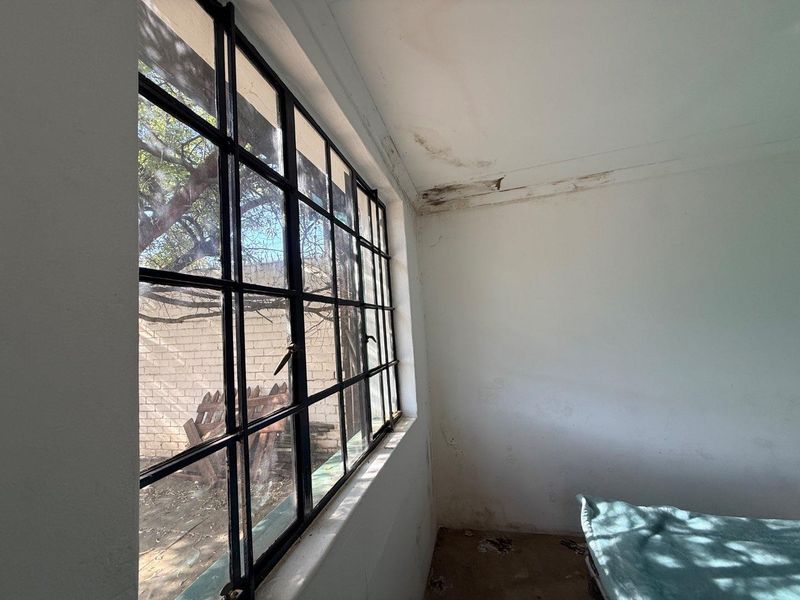 Charming 2-Bed Home with Two Bonus Units for Extra Income - Photo 4
