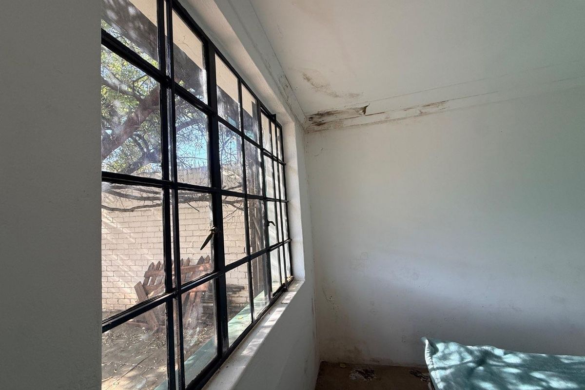 Charming 2-Bed Home with Two Bonus Units for Extra Income - Photo 4