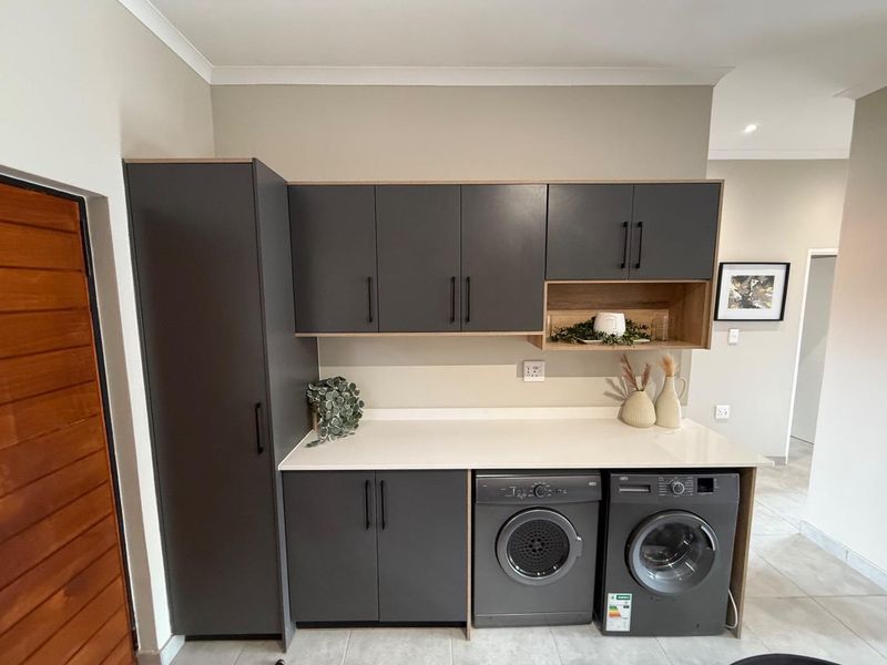 Sophisticated 3-Bedroom Simplex with Double Garage and Private Garden Sanctuary - Photo 8