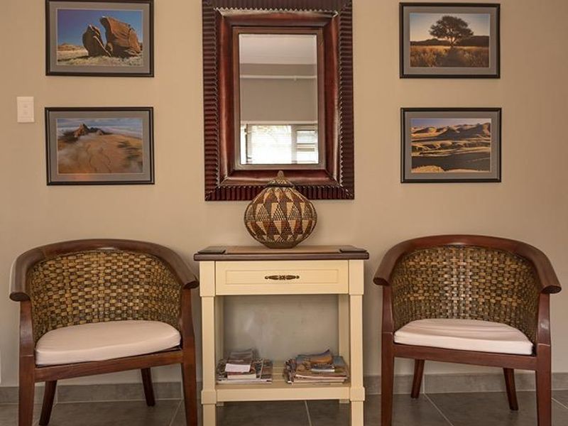 A well-maintained entry area featuring neutral wall tones and durable tiled flooring, creating a welcoming and organized transition space.