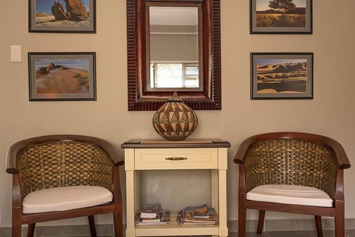 A well-maintained entry area featuring neutral wall tones and durable tiled flooring, creating a welcoming and organized transition space.