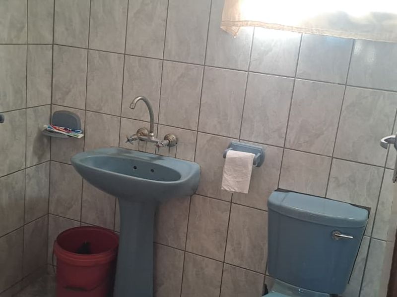 Peaceful 3-Bedroom Family Home with 2 Rondavels for Extra Income Potential - Photo 8
