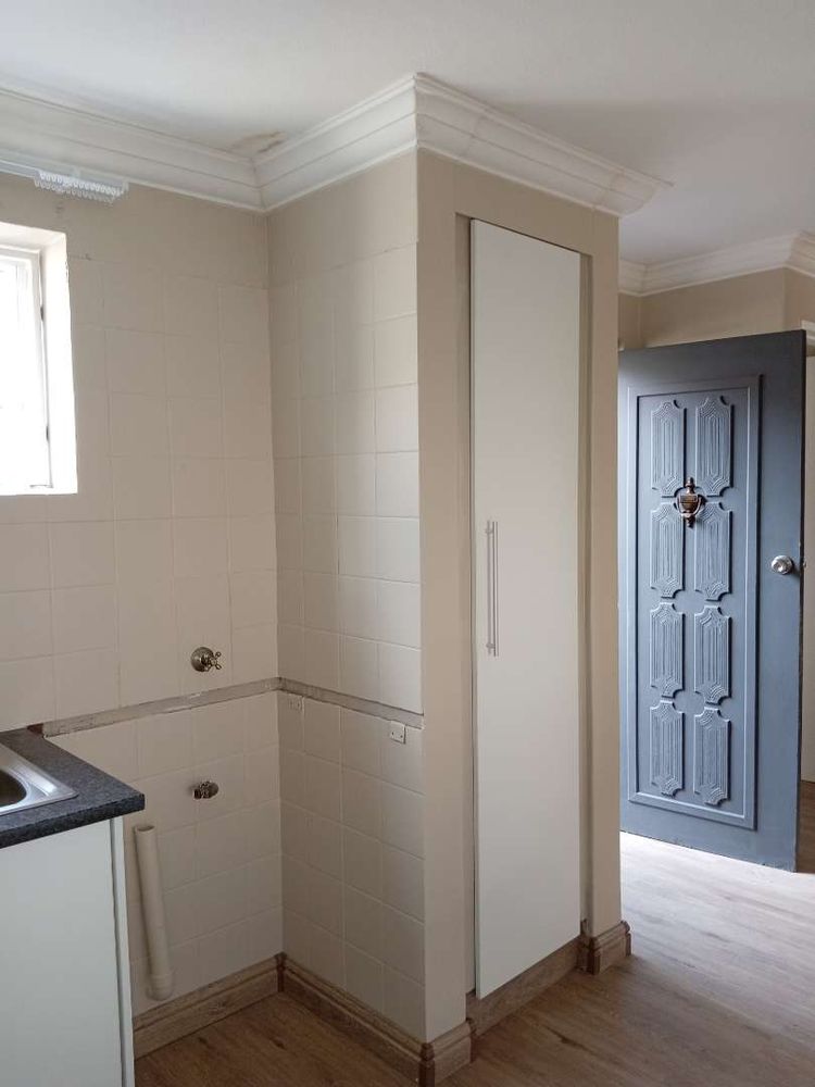 Top loader area with pantry cupboard