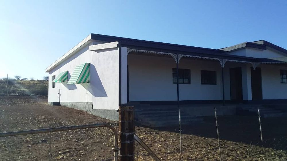 Front/side view of second house as well as a gate for entrance