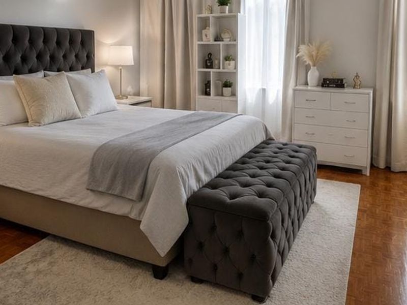 A well-maintained bedroom featuring classic parquet flooring and neutral wall finishes, creating a comfortable and inviting living space.