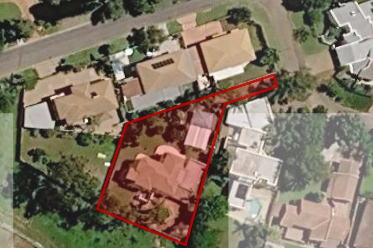 An aerial view of the property showing the house footprint and surrounding garden area within the highlighted boundary.