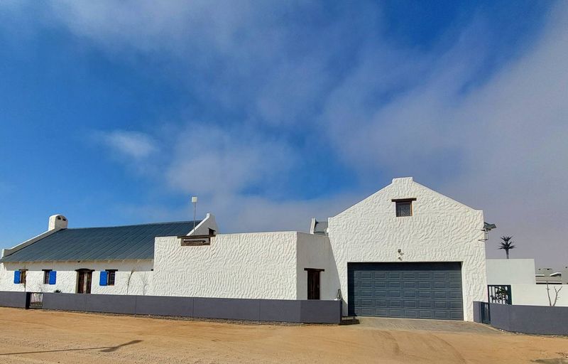 Fully Furnished Coastal Home with Multiple Garages & Storage