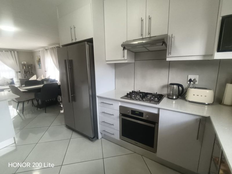 1. "Discover Your Dream Home in Mackenzie Palms!" 2. "Luxurious Living Awaits in This 3-Bedroom Gem!" 3. "Modern Comfort Meets Security in Mackenzie Palms!" 4. - Photo 10