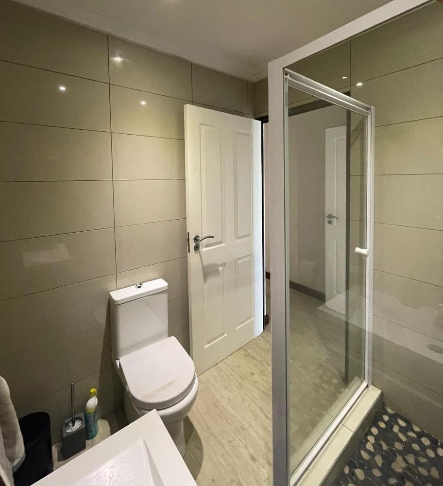 Shared bathroom with shower and toilet