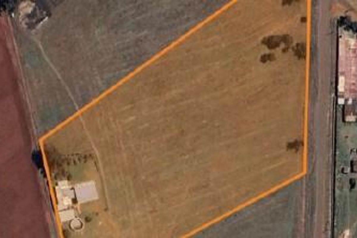 Aerial view of the small holding property showing the land boundaries, main dwelling, and surrounding agricultural landscape.