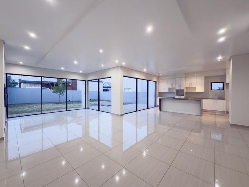 Modern Architectural Gem with Versatile Living & Expansive Balcony in Midstream Meadows - Photo 3