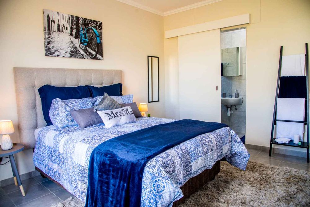 Main bedroom with built-in cupboards & ensuite.