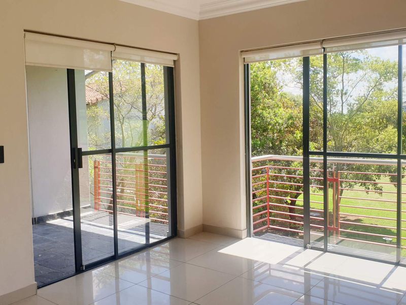 Swing Into Style: Sunlit 1st Floor Haven with Designer Kitchen in Golf Estate - Photo 7