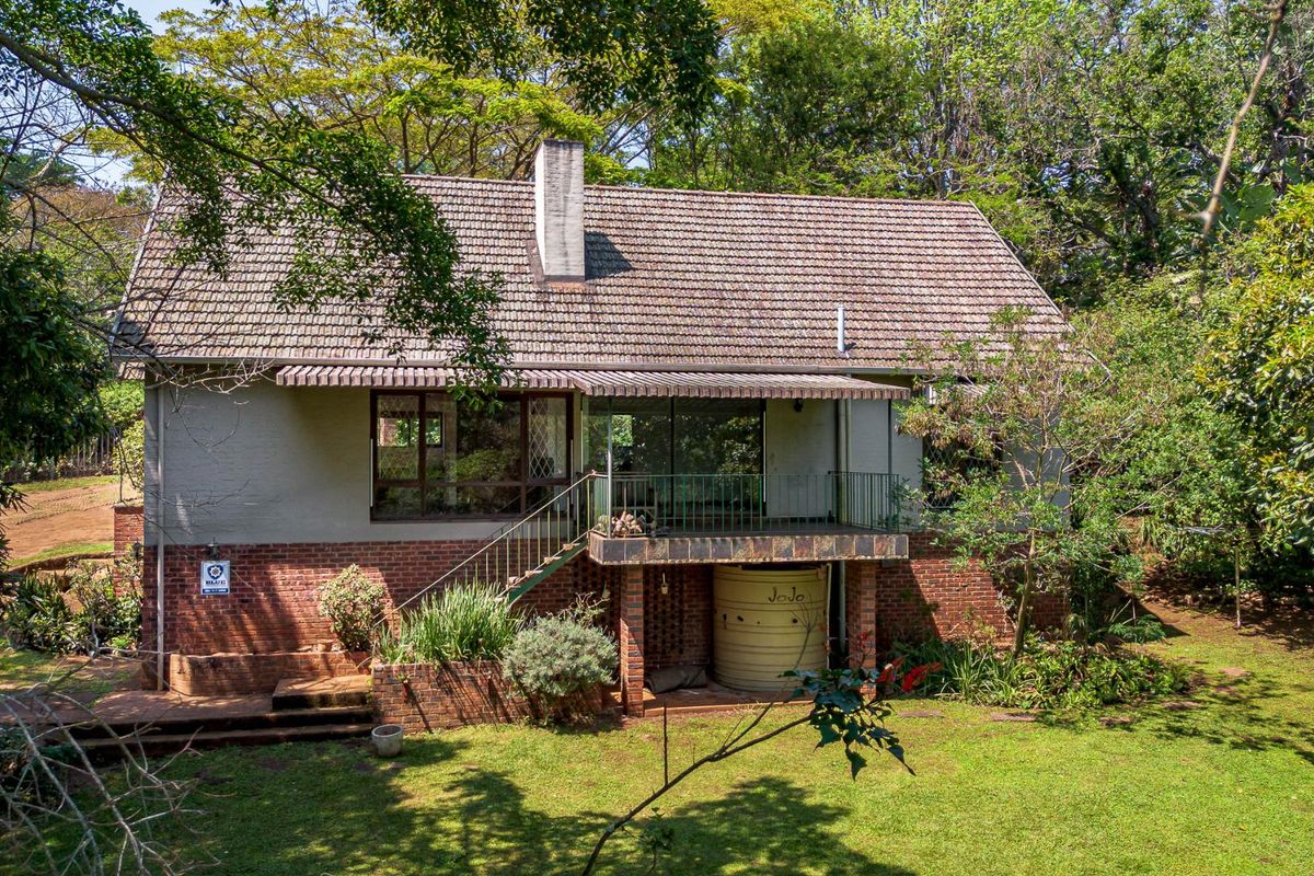 CHARACTER FILLED FAMILY HOME TUCKED AWAY IN A LUSH GARDEN - Photo 2