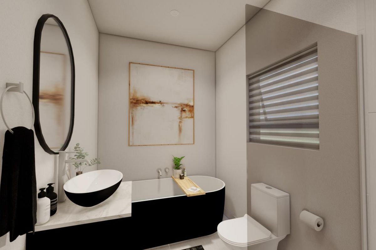 Modern bathroom featuring a sleek freestanding bathtub, contemporary vessel sink on a stone vanity, and a wall-mounted toilet.