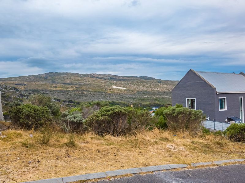 A scenic view overlooking the natural landscape and surrounding hills from the residential property.