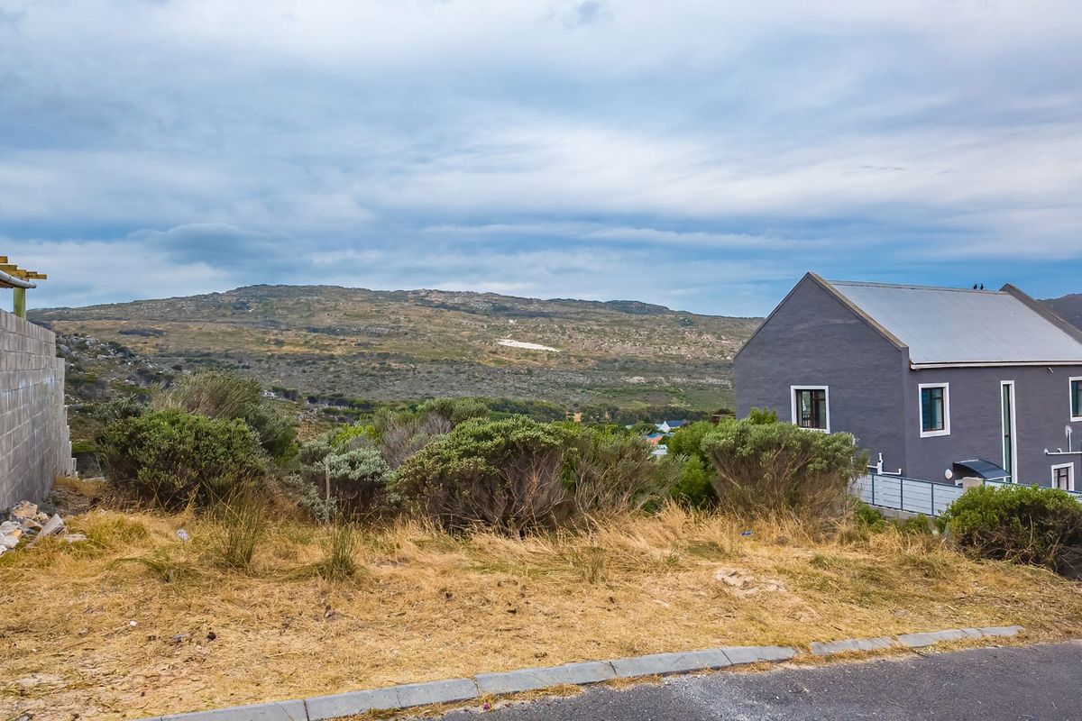 A scenic view overlooking the natural landscape and surrounding hills from the residential property.