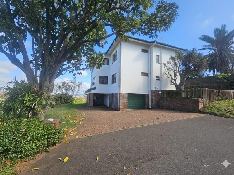 Front exterior view of a multi-story house featuring a paved driveway, integrated garage, and established garden surroundings.