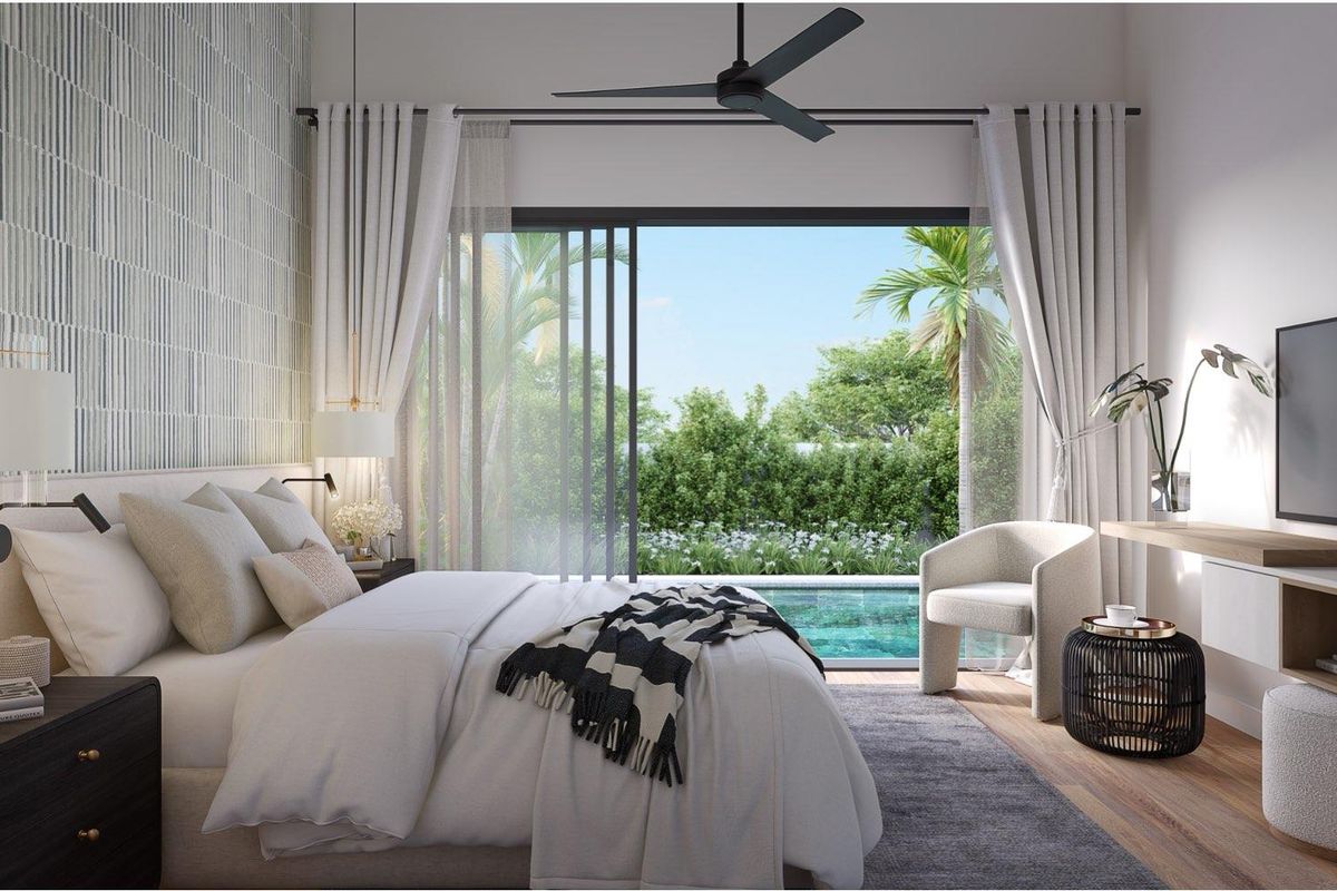 A modern bedroom featuring a ceiling fan, textured feature wall, and large sliding glass doors opening directly onto a private pool area.