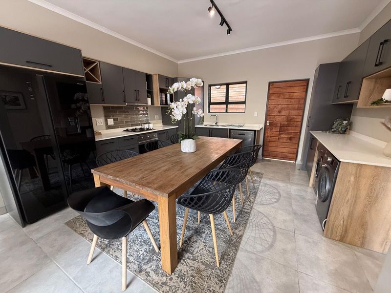 Sophisticated 3-Bedroom Simplex with Double Garage and Private Garden Sanctuary - Photo 4