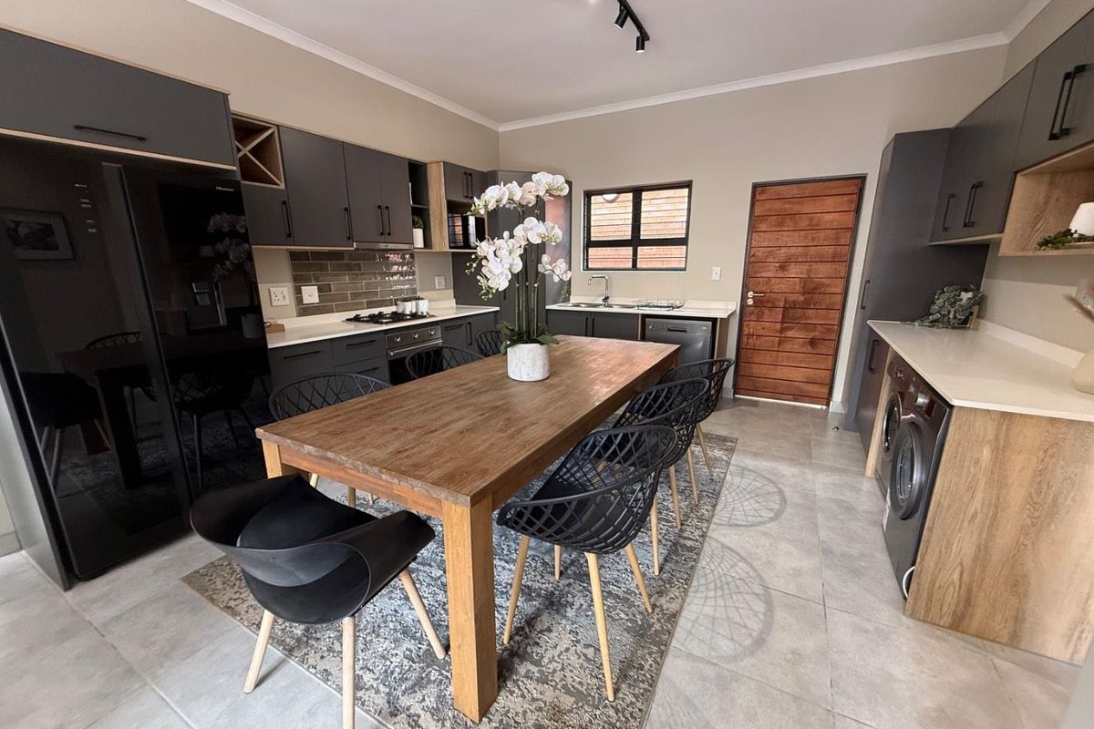 Sophisticated 3-Bedroom Simplex with Double Garage and Private Garden Sanctuary - Photo 4