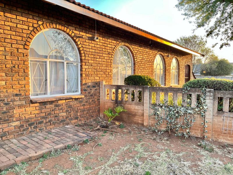 "Elegant Face Brick Home with Modern Security and Ample Parking! - Photo 2