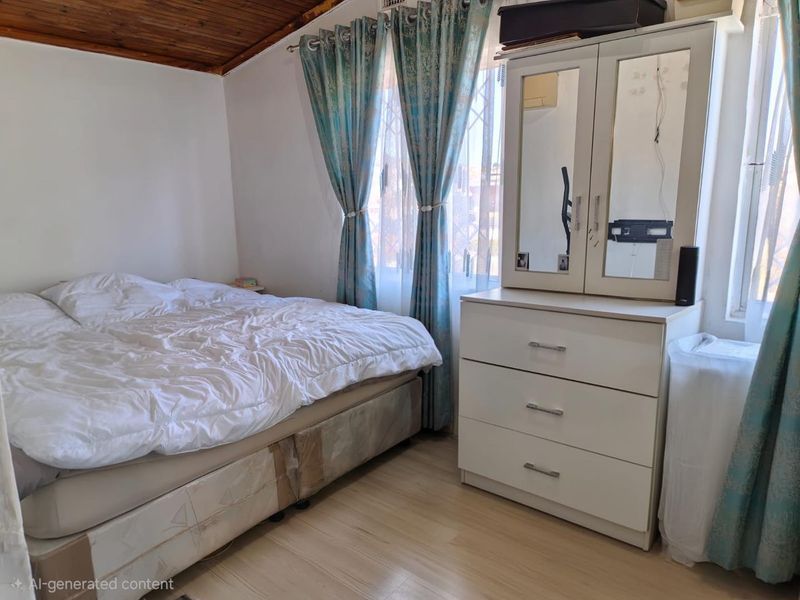 A bedroom featuring a timber-paneled ceiling, laminate flooring, and security bars on the windows.
