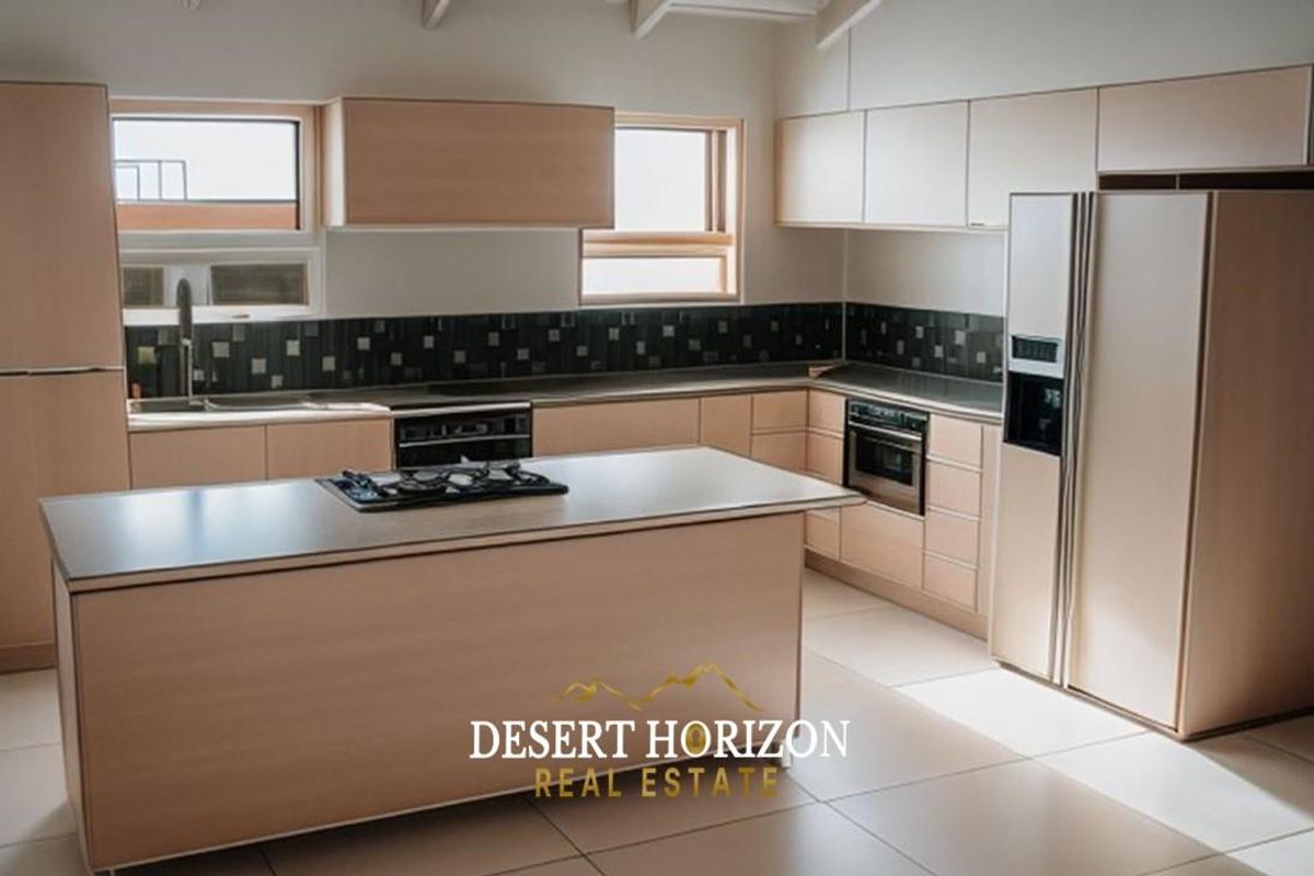 Modern kitchen featuring light wood cabinetry, a central island with a built-in gas hob, integrated oven, and tiled flooring.