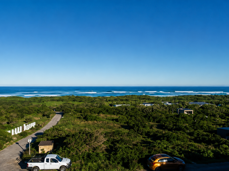 A scenic elevated view overlooking the coastal landscape and ocean, showcasing the natural surroundings of the residential area.