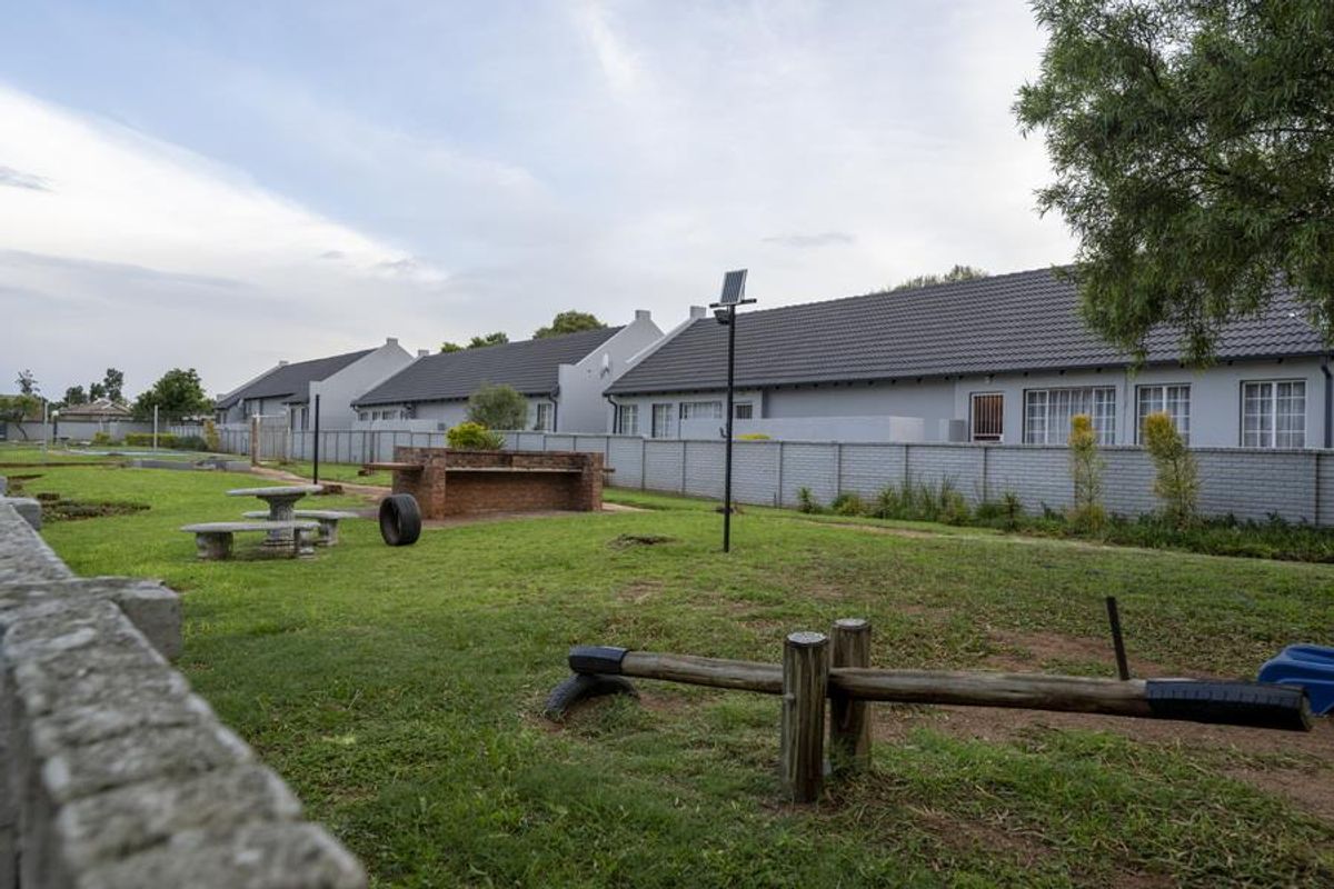 SECURE LIVING WITH POTENTIAL: 2-BEDROOM HOME WITH CHARM - Photo 5