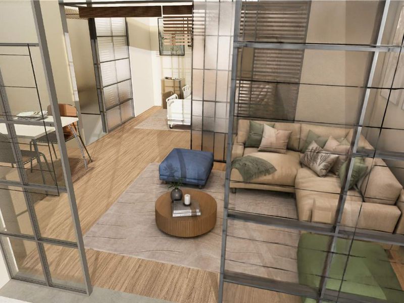 Modern open-plan living area featuring contemporary glass partition walls and light wood-look flooring, creating a bright and segmented interior space.