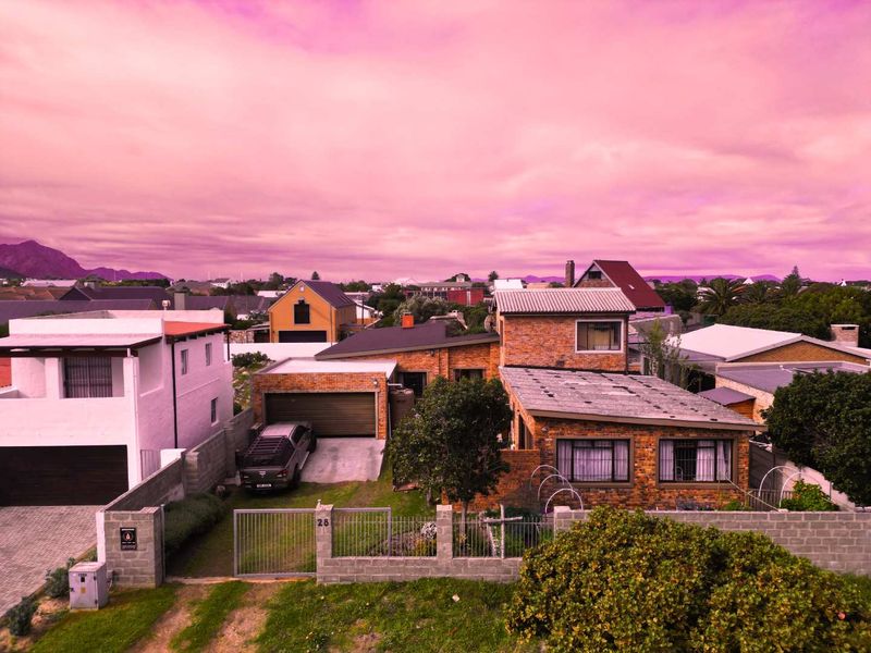 Steps from Sandbaai Beach: Spacious Family Living With Room to Grow! - Photo 1