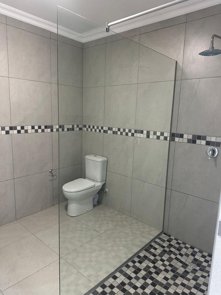 First bathroom with shower and toilet
