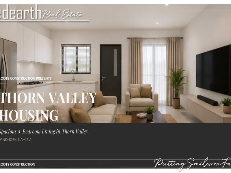 Modern open-plan living area featuring a sleek kitchen with built-in cabinetry and direct access to an outdoor space through sliding glass doors.