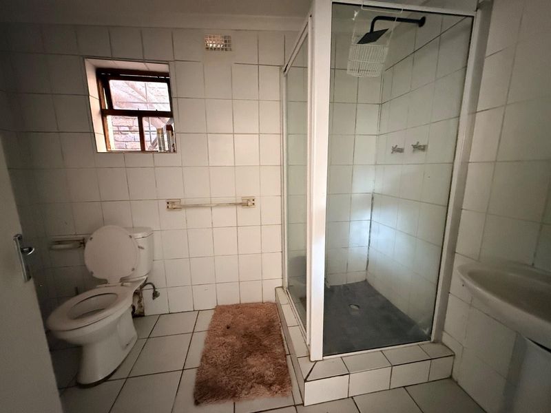 Charming 2-Bed Home with Two Bonus Units for Extra Income - Photo 7