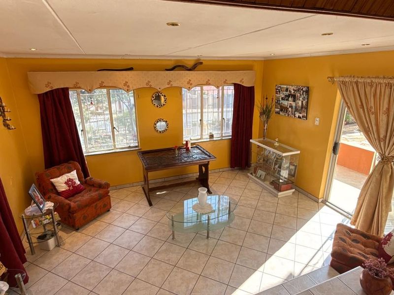 Set high above street level on a massive erf with a large front garden and elevated views - Photo 8