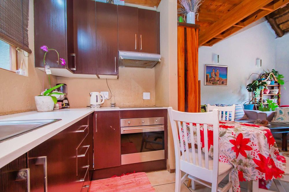 Upgraded kitchen offers darkwood style cupboards