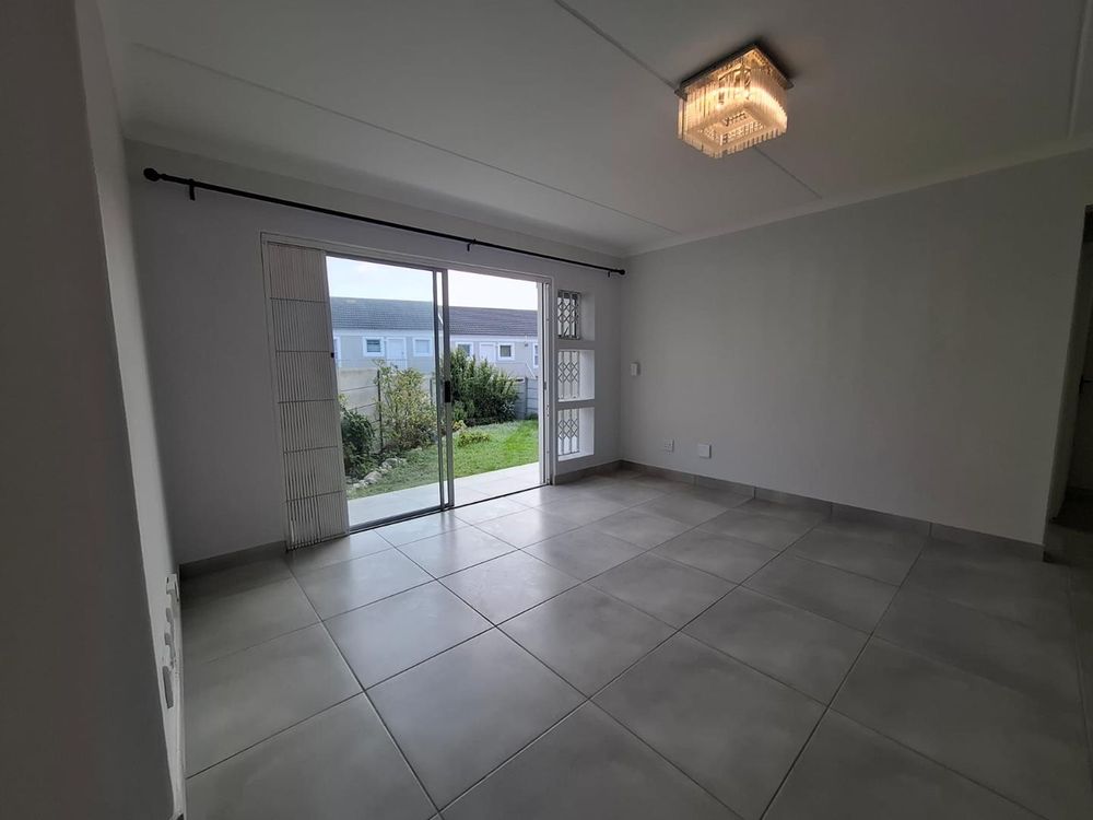 Open plan lounge leading to garden area