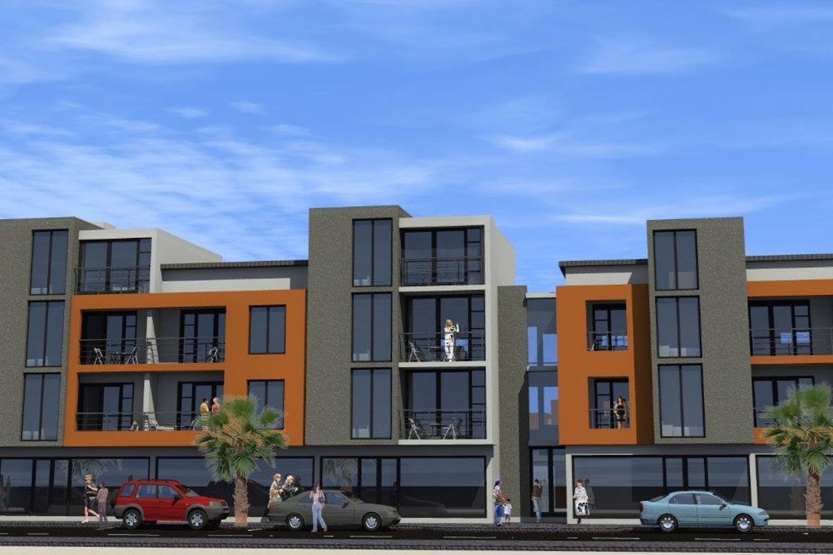 A modern multi-story apartment building featuring contemporary facade design, private balconies, and ground-floor commercial space.
