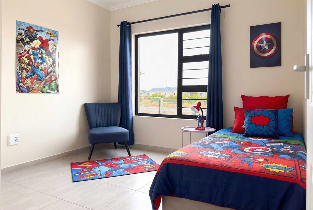 Second bedroom with built-in cupboards.