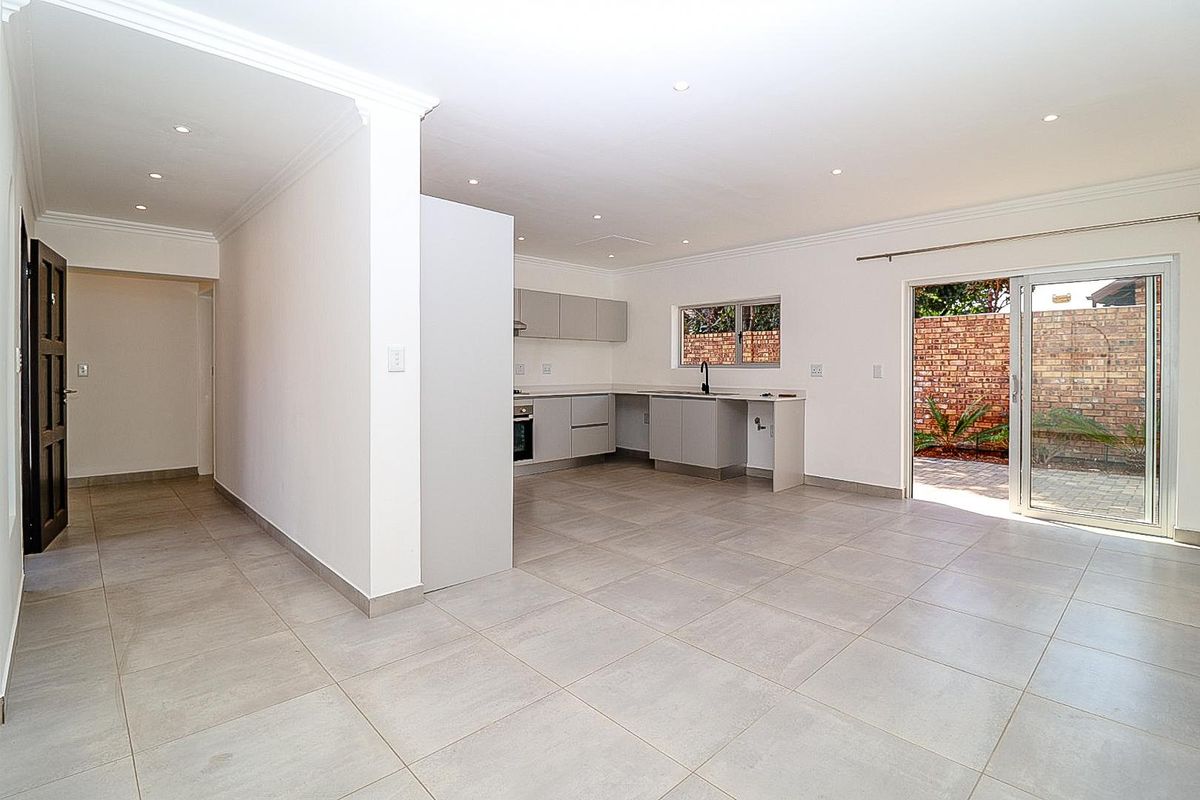 Modern Comfort Meets Secure Garden Living! - Photo 2