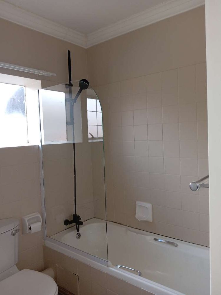 En-suite bathroom with bath and overhead shower