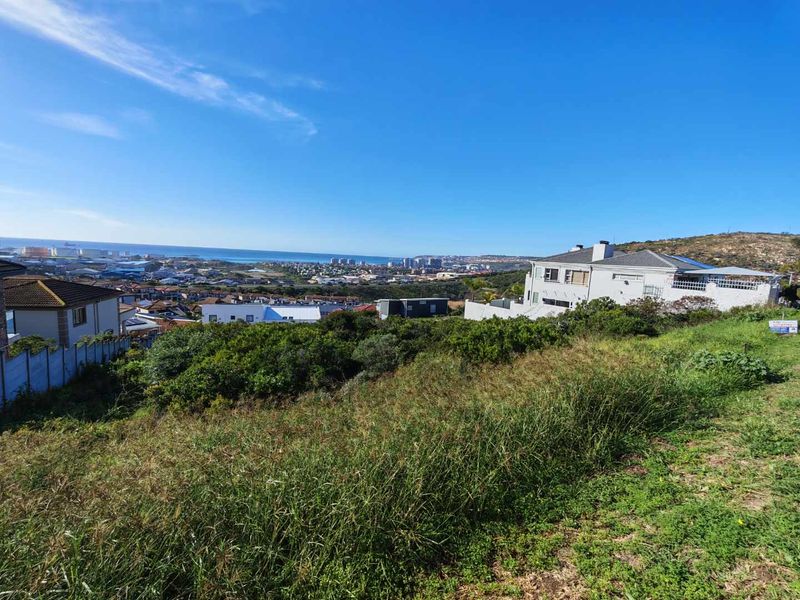A view of the coastal landscape and surrounding residential area from the vacant residential plot.