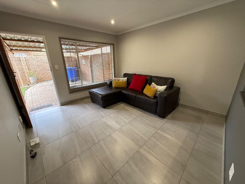 Stylishly Renovated Two-Bedroom Simplex with Double Garage and Garden - Photo 7