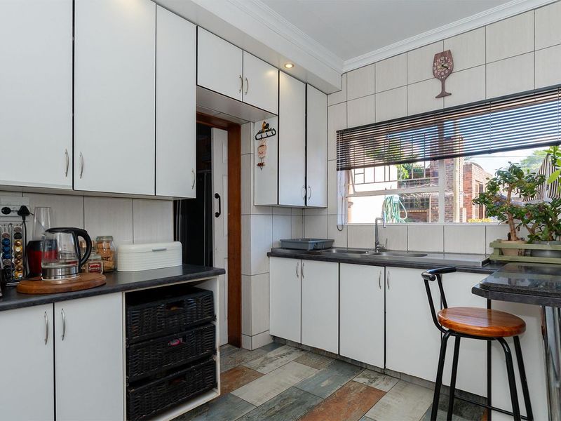 Spacious 5-Bedroom Family Home with Income-Generating Flatlet in Birch Acres - Photo 9