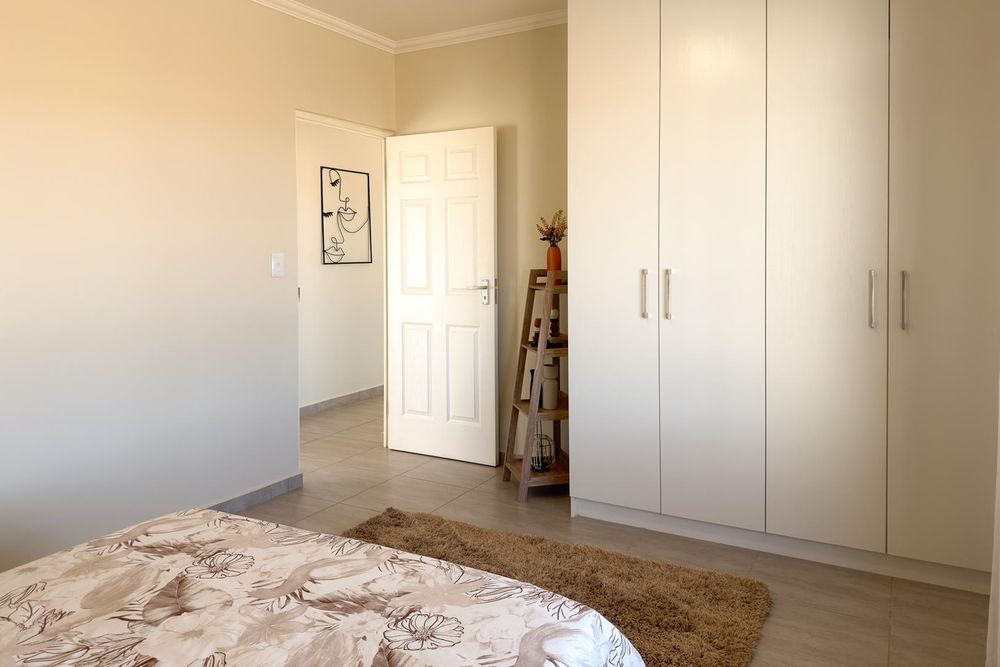 Main bedroom with built-in cupboards.